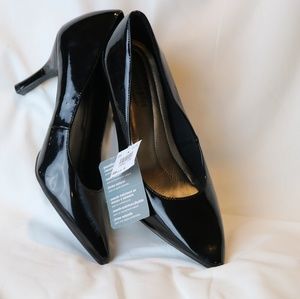 Black Patent heels. Never worn. New with tag.